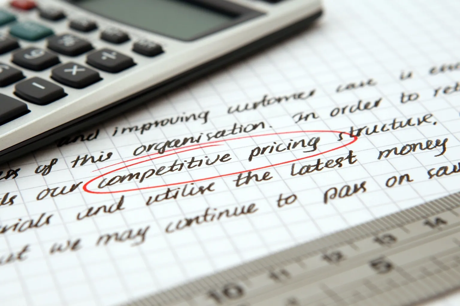 Handwritten notes with the phrase "competitive pricing structure" circled in red next to a calculator