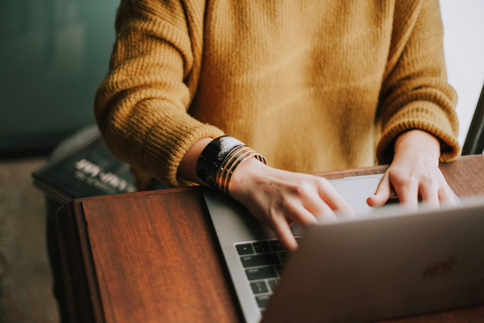 Consultant working on a laptop building out their first offer and pricing
