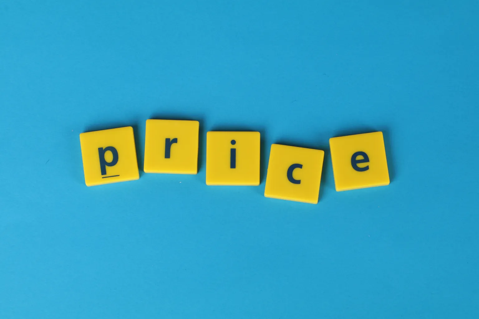 Yellow letter tiles spelling out the word "price" on a blue background